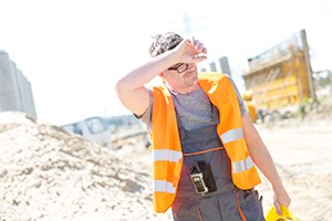 A photo of a worker working in extreme heat